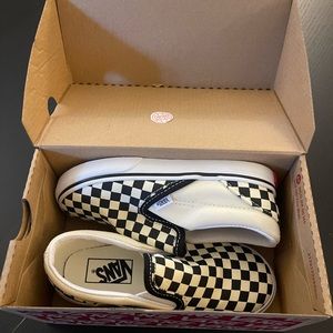 Vans toddler slip-on shoe in classic black and white check. New with box.